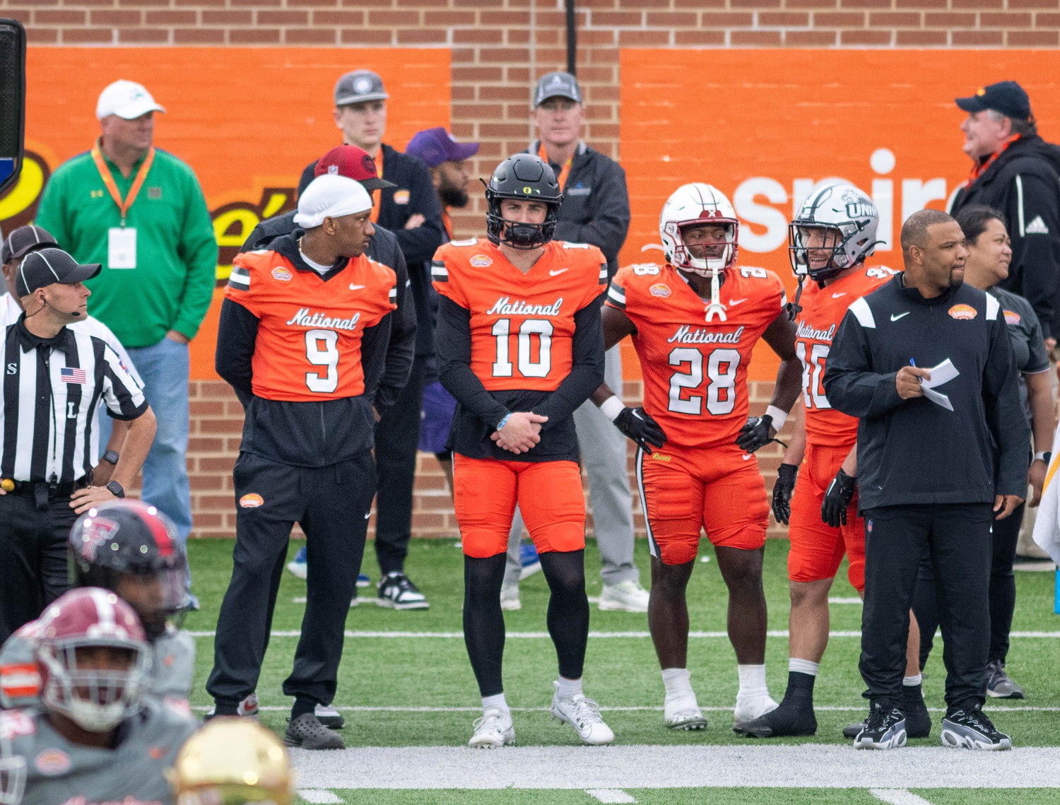 Former Washington QB Michael Penix Jr.(9) and former Oregon QB Bo Nix (10) watch the action from the sideline during the Reese's Senior Bowl in Mobile, Alabama on Saturday, Feb. 3, 2024.  